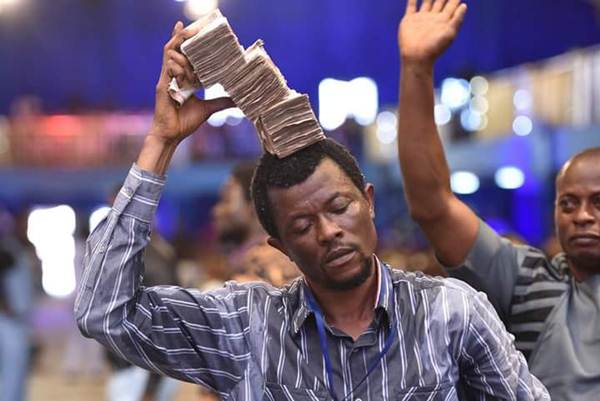 Prophet Jeremiah Showers Money On Fellow Pastor