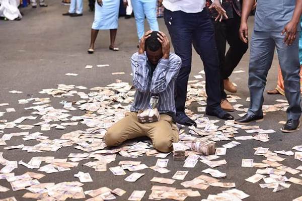 Prophet Jeremiah Showers Money On Fellow Pastor