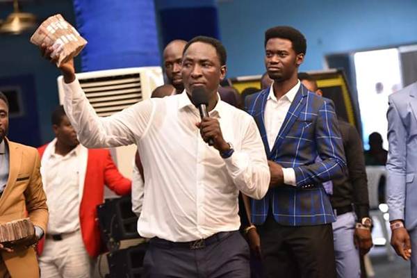 Prophet Jeremiah Showers Money On Fellow Pastor